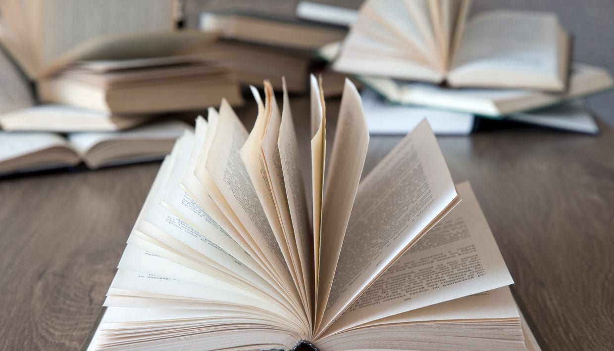 books on wooden deck tabletop