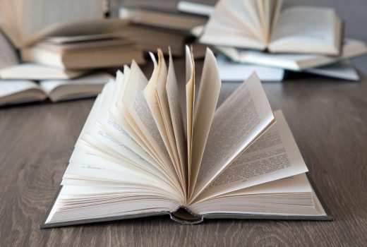books on wooden deck tabletop